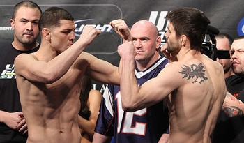 Nick Diaz (left) posturing with Carlos Condit/ photo cred: Scott Petersen for MMAWeekly.com