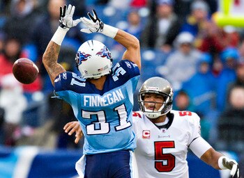 NASHVILLE, TN - NOVEMBER 27:   Quarterback Josh Freeman #5 of the Tampa Bay Buccaneers throws a pass around Cortland Finnegan #31 of the Tennessee Titans at LP Field on November 27, 2011 in Nashville, Tennessee.  (Photo by Wesley Hitt/Getty Images)