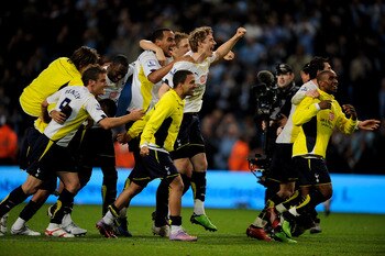 Tottenham's players celebrate as Redknapp becomes the first Spurs boss since Bill Nicholson to qualify for the Champions League/European Cup.