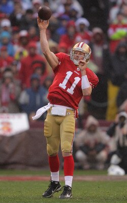 SAN FRANCISCO, CA - JANUARY 22:  Alex Smith #11 of the San Francisco 49ers throws a 73-yard touchdown reception in the first quarter to Vernon Davis #85 against the New York Giants during the NFC Championship Game at Candlestick Park on January 22, 2012 i