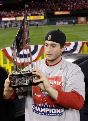 David Freese prepares to hoist the World Series trophy after winning World Series MVP honors.