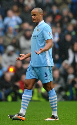 MANCHESTER, ENGLAND - JANUARY 08:  Vincent Kompany of Manchester City reacts after being shown a red card during the FA Cup Third Round match between Manchester City and Manchester United at the Etihad Stadium on January 8, 2012 in Manchester, England.  (