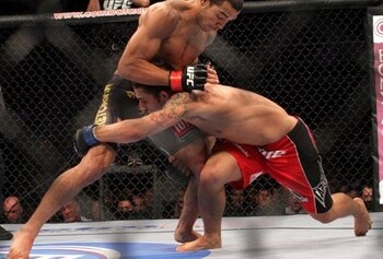 Jose Aldo stuffing a takedown by Chad Mendes- Photo by Sherdog.com
