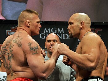Brock Lesnar (L) squares off with Shane Carwin - Rob Tatum/The MMA Corner