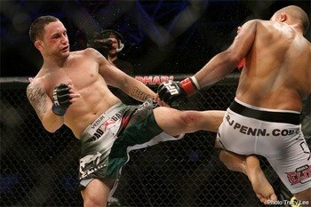 Frankie Edgar (L) delivers a kick against BJ Penn - Tracy Lee/Yahoo Sports