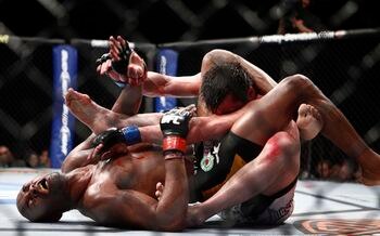 Anderson Silva (bottom) chokes Chael Sonnen - Esther Lin/AOL