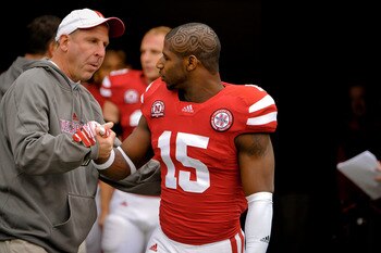 LINCOLN, NE - NOVEMBER 25: Cornerback Alfonzo Dennard #15 of the Nebraska Cornhuskers is greeted by Head Coach Bo Pelini on senior day before playing a  game against the Iowa Hawkeyes at Memorial Stadium November 25, 2011 in Lincoln, Nebraska. Nebraska de