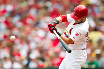 ST. LOUIS, MO - APRIL 28: Skip Schumaker #55 of the St. Louis Cardinals makes contact on a pitch during a game against the Milwaukee Brewers at Busch Stadium on April 28, 2012 in St. Louis, Missouri. (Photo by David Welker/Getty Images)