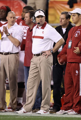 TEMPE, AZ - DECEMBER 30: Head coach Bob Stoops of the Oklahoma Sooners watches from the sidelines during the Insight Bowl against the Iowa Hawkeyes at Sun Devil Stadium on December 30, 2011 in Tempe, Arizona. The Sooners defeated the Hawkeyes 31-14. (Ph