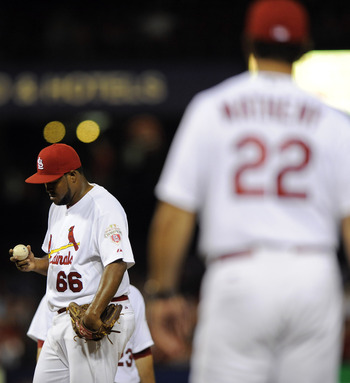 Manager Mike Matheny (22) has made too many long walks to the mound to hook pitchers like Victor Marte (66) in middle relief of close games.