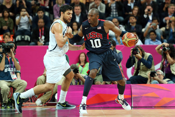 LONDON, ENGLAND - AUGUST 06: Kobe Bryant #10 of United States handles the ball against Carlos Delfino #10 of Argentina during the Men's Basketball Preliminary Round match on Day 10 of the London 2012 Olympic Games at the Basketball Arena on August 6, 201
