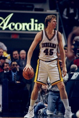 Center Rik Smits of the Indiana Pacers looks on during a game against the Golden State Warriors at the Market Square Arena in Indianapolis, Indiana. The Pacers won the game, 96-83.