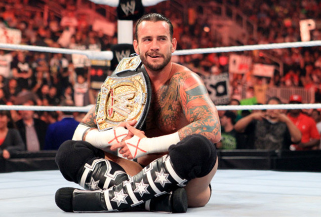 CM Punk Sets Another Milestone: 400 Days As WWE Champ! +  Barrett On A Losing Streak CM-Punk-Sitting-On-The-Ring_crop_650x440