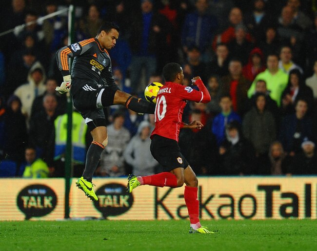 hi-res-186709894-michel-vorm-of-swansea-challenges-fraizer-campbell-of_crop_650.jpg?1383503124