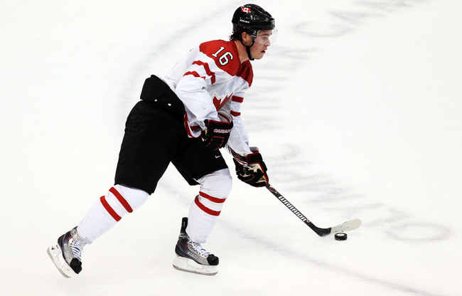 Hi-res-97033413-jonathan-toews-of-canada-controls-the-puck-during-the_crop_650