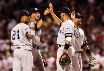 25 July 2008: Robinson Cano (24), Derek Jeter, Alex Rodriguez, and Bobby Abreu congratulate each other after the New York Yankees win over the Boston Red Sox 1-0 at Fenway Park in Boston, MA.