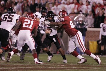 22 November 2008: Texas Tech quarterback Graham Harrell (6) is tackled by Oklahoma Sooner defensive tackle Gerald McCoy (93) during the University of Oklahoma Sooners 65-21 win over the University of Texas Tech Red Raiders at the Gaylord Family-Memorial S
