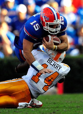 GAINESVILLE, FL - SEPTEMBER 19: Tim Tebow #15 of the Florida Gators is tackled by Eric Berry #14 of the Tennessee Volunteers during the game at Ben Hill Griffin Stadium on September 19, 2009 in Gainesville, Florida. (Photo by Sam Greenwood/Getty Images)