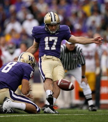 SEATTLE - SEPTEMBER 19:  Place kicker Erik Folk #17 of the Washington Huskies kicks a 26 yard field goal in the fourth quarter to make the score 16-13 in favor of the USC Trojans on September 19, 2009 at Husky Stadium in Seattle, Washington. Folk later ki