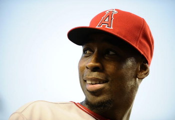 NEW YORK - SEPTEMBER 14: Chone Figgins #9 of the Los Angeles Angels of Anaheim stands in the dugout before a game against the New York Yankees at Yankee Stadium on September 14, 2009 in the Bronx borough of New York City. (Photo by Jeff Zelevansky/Getty