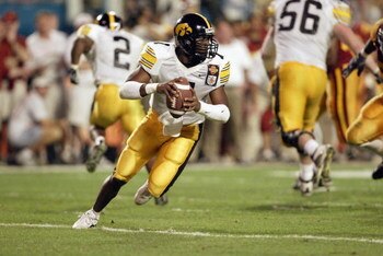 MIAMI - JANUARY 2:  Brad Banks #7 of Iowa rolls out against USC during the FedEx Orange Bowl at Pro Player Stadium on January 2, 2003 in Miami, Florida.  USC defeated Iowa 38-17.  (Photo by Andy Lyons/Getty Images)