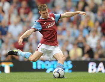 BIRMINGHAM, ENGLAND - SEPTEMBER 19:  James Milner of Aston Villa scores from the spot during the Barclays Premier League match between Aston Villa and Portsmouth at Villa Park on September 19, 2009 in Birmingham, England.  (Photo by Laurence Griffiths/Get