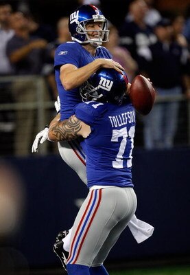 ARLINGTON, TX - SEPTEMBER 20:  Kicker Lawrence Tynes #9 of the New York Giants celebrates his game winning field goal with Dave Tollefson #71 against the Dallas Cowboys at Cowboys Stadium on September 20, 2009 in Arlington, Texas.  (Photo by Ronald Martin