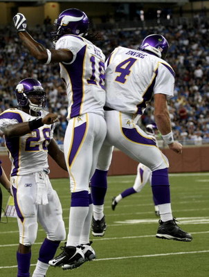 DETROIT - SEPTEMBER 20: Quarterback Brett Favre #4 of the Minnesota Vikings celebrates with Sidney Rice #18 and Adrian Peterson #2 after throwing a touchdown pass in the second quarter against the Detroit Lions at Ford Field on September 20, 2009 in Detr