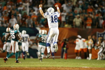 MIAMI - SEPTEMBER 21: Quarterback Peyton Manning #18 of the Indianapolis Colts celebrates after throwing the game-winning touchdown pass in the fourth quarter against the Miami Dolphins at Land Shark Stadium on September 21, 2009 in Miami, Florida. The C