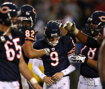 CHICAGO - SEPTEMBER 20: Robbie Gould #9 of the Chicago Bears smiles as teammates including Greg Olsen #82 and Kevin Shaffer #78 congratulate him for kicking the game-winning field goal againstof the Pittsburgh Steelers on September 20, 2009 at Soldier Fie