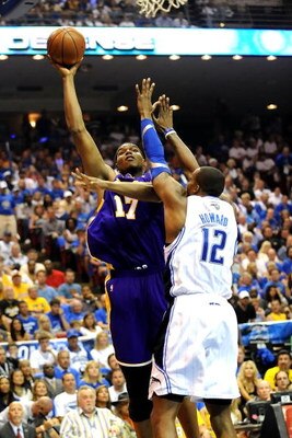 ORLANDO, FL - JUNE 14:  Andrew Bynum #17 of the Los Angeles Lakers goes up for a shot over Dwight Howard #12 of the Orlando Magic in the second quarter of Game Five of the 2009 NBA Finals on June 14, 2009 at Amway Arena in Orlando, Florida.  NOTE TO USER: