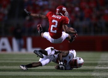 PISCATAWAY, NJ - SEPTEMBER 29:  Tim Brown #2 of the Rutgers Scarlet Knights is tackled by Kevin Barnes #2 of the Maryland Terrapins during their game at Rutgers Stadium on September 29, 2007 in Piscataway, New Jersey.  (Photo by Nick Laham/Getty Images)