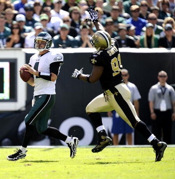 PHILADELPHIA - SEPTEMBER 20:  Kevin Kolb of the Philadelphia Eagles passes under pressure from the Will Smith of the New Orleans Saints during their game at Lincoln Financial Field on September 20, 2009 in Philadelphia, Pennsylvania.  (Photo by Jeff Zelev