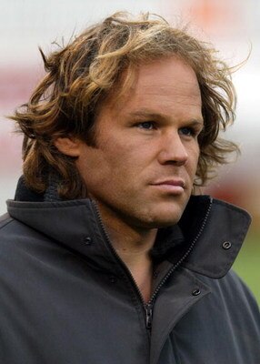 CHRISTCHURCH, NEW ZEALAND - MARCH 02:  Ex All Black Josh Kronfeld stands side line as a TV comments person, during the Super 12 rugby match between the Blues and the Crusaders played at Jade Stadium, Christchurch New Zealand, February 27, 2004. The Blues 