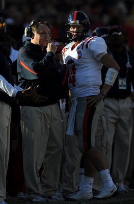 DALLAS - JANUARY 02:  Head coach Houston Nutt talks with Jevan Snead #4 of the Mississippi Rebels between downs against the Texas Tech Red Raiders during the AT&T Cotton Bowl on January 2, 2009 at the Cotton Bowl in Dallas, Texas.  (Photo by Ronald Martin