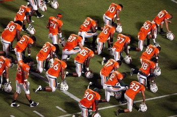 FORT LAUDERDALE, FL - SEPTEMBER 17: The Miami Hurricanes say a prayer in the end-zone before taking on the Georgia Tech Yellow Jackets at Land Shark Stadium on September 17, 2009 in Fort Lauderdale, Florida. Miami defeated Georgia Tech 33-17. (Photo by