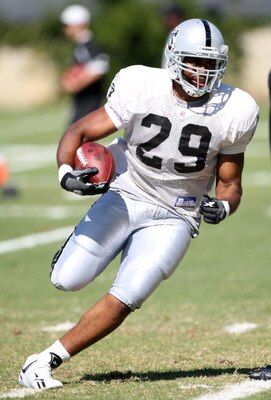 NAPA, CA - AUGUST 05: Michael Bush #29 runs with the ball during the Oakland Raiders Training Camp at the Napa Valley Marriott on August 5, 2009 in Napa, California.  (Photo by Jed Jacobsohn/Getty Images)