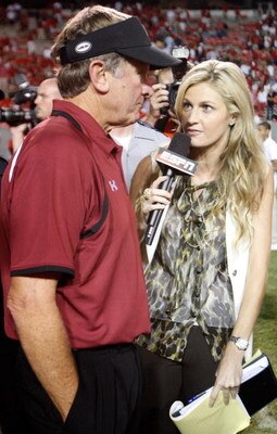 RALEIGH, NC - SEPTEMBER 03:  ESPN sideline reporter Erin Andrews interviews head coach Steve Spurrier of the South Carolina Gamecocks after their game against the North Carolina State Wolfpack at Carter-Finley Stadium on September 3, 2009 in Raleigh, Nort