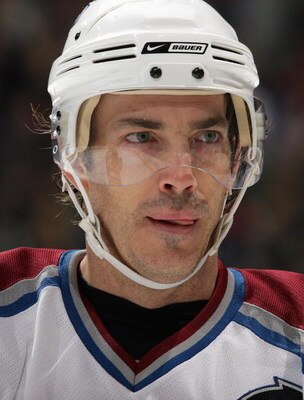 VANCOUVER, CANADA - MARCH 25:  Joe Sakic #19 of the Colorado Avalanche looks on during a break in NHL game action against the Vancouver Canucks at General Motors Place on March 25, 2007 in Vancouver, British Columbia, Canada. The Avalanche defeated Canuck