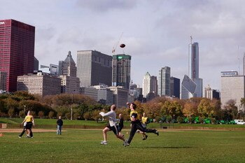 CHICAGO - OCTOBER 24:  Men play a game of touch football at Hutchinson Field in Grant Park October 24, 2008 in Chicago, Illinois. Democratic Presidential candidate Senator Barack Obama (D-IL) is expected to hold his election night rally in the field on No