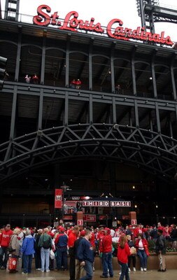 ST. LOUIS - MARCH 31:  St. Louis Cardinals fans arrive at Busch Stadium for the opening day against the Colorado Rockies on March 31, 2008 in St. Louis, Missouri.  (Photo by Elsa/Getty Images)
