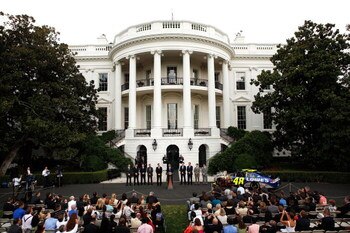 WASHINGTON - AUGUST 19:  U.S. President Barack Obama (C) speaks during a South Portico event at the White House August 19, 2009 in Washington, DC. Obama hosted 2008 NASCAR Sprint Cup champion Jimmie Johnson and other drivers to honor their accomplishment 