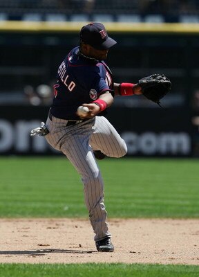 CHICAGO - JULY 08: Luis Castillo #1 of the Minnesota Twins makes an off-balance throw to get Paul Konerko of the the Chicago White Sox at first base on July 8, 2007 at U.S. Cellular Field in Chicago, Illinois. The White defeated the Twins 6-3.  (Photo by 
