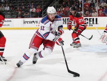NEWARK, NJ - SEPTEMBER 16: Ales Kotalik #12 of the New York Rangers skates against the New Jersey Devils at the Prudential Center on September 16, 2009 in Newark, New Jersey. The Devils defeated the Rangers 3-2 in the shoot out. (Photo by Bruce Bennett/Ge