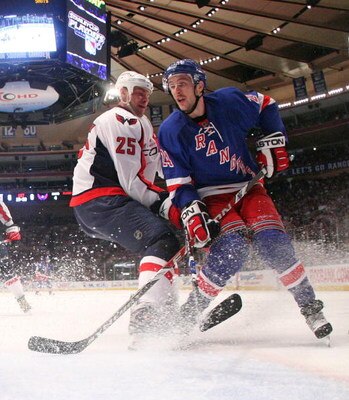 NEW YORK - APRIL 26: Ryan Callahan #24 of the New York Rangers skates against Viktor Kozlov #25 of the Washington Capitals during Game Six of the Eastern Conference Quarterfinal Round of the 2009 NHL Stanley Cup Playoffs at Madison Square Garden on April 