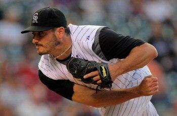 DENVER - SEPTEMBER 08:  Starter Jason Marquis #21 of the Colorado Rockies pitches against the Cincinnati Reds at Coors Field on September 8, 2009 in Denver, Colorado.  (Photo by Doug Pensinger/Getty Images)