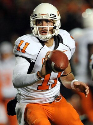 LUBBOCK, TX - NOVEMBER 08:  Quarterback Zac Robinson #11 of the Oklahoma State Cowboys during play against the Texas Tech Red Raiders at Jones AT&T Stadium on November 8, 2008 in Lubbock, Texas.  (Photo by Ronald Martinez/Getty Images)