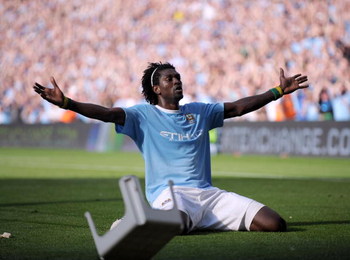 MANCHESTER, ENGLAND - SEPTEMBER 12: Emmanuel Adebayor of Manchester City celebrates in front of the Arsenal fans after scoring during the Barclays Premier League match between Manchester City and Arsenal at the City of Manchester Stadium on September 12,