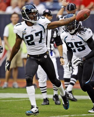 HOUSTON - SEPTEMBER 27:  Cornerback Rasheem Mathis #27 of the Jacksonville Jaguars celebrates with safety Reggie Nelson after intercepting a pass meant for  wide receiver Andre Johnson #80 of the Houston Texans at Reliant Stadium on September 27, 2009 in 