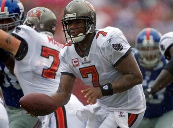 TAMPA, FL - SEPTEMBER 27:  Quarterback Byron Leftwich #7 of the Tampa Bay Buccaneers hands the ball off against the New York Giants during the game at Raymond James Stadium on September 27, 2009 in Tampa, Florida.  (Photo by J. Meric/Getty Images)